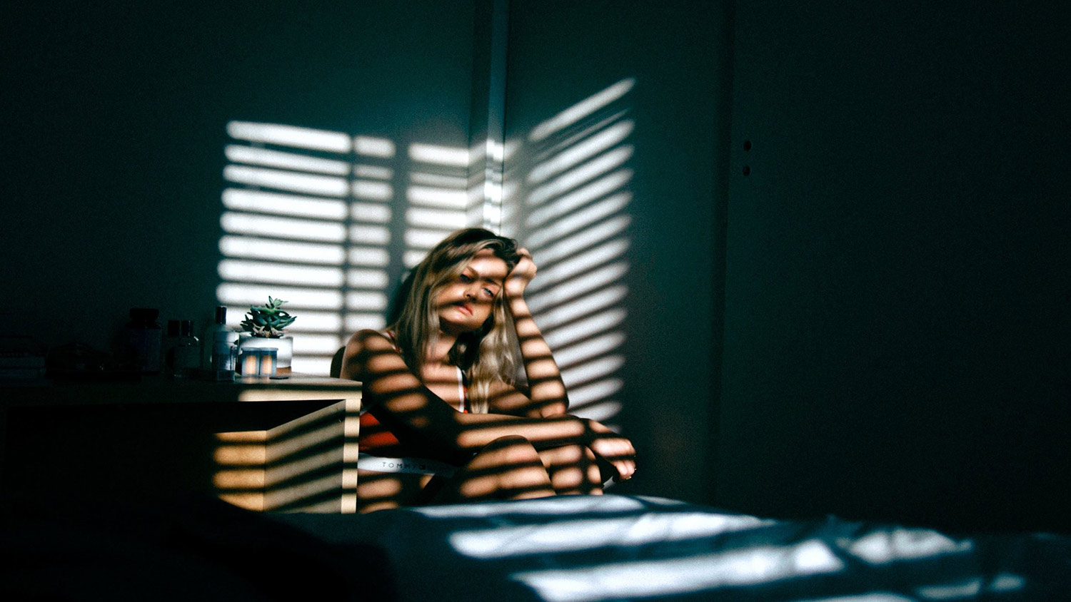 woman-with-blinds-shadow