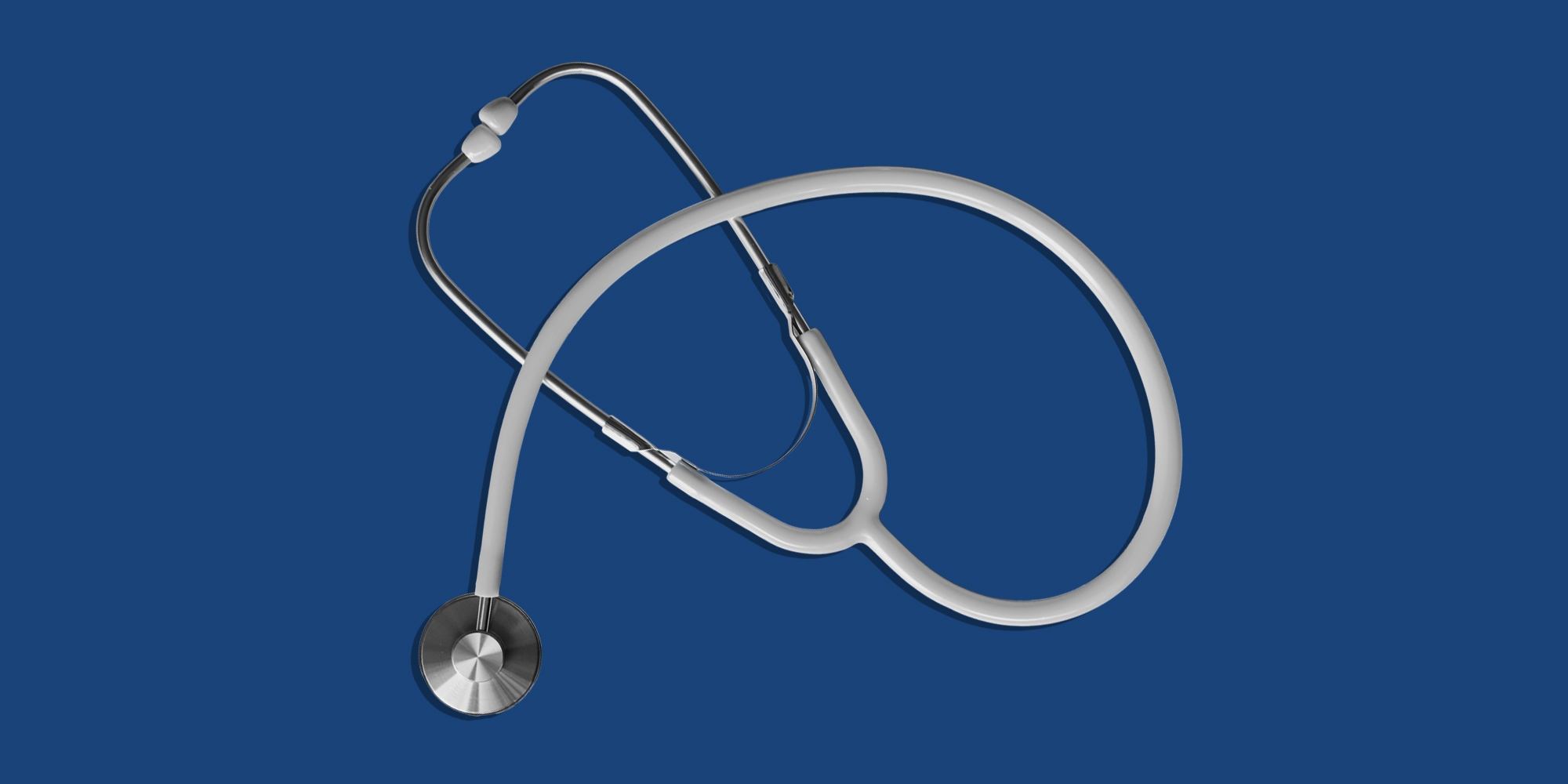 Stethoscope on a blue background. Prescription pill addiction