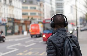 man-walking-with-headphones
