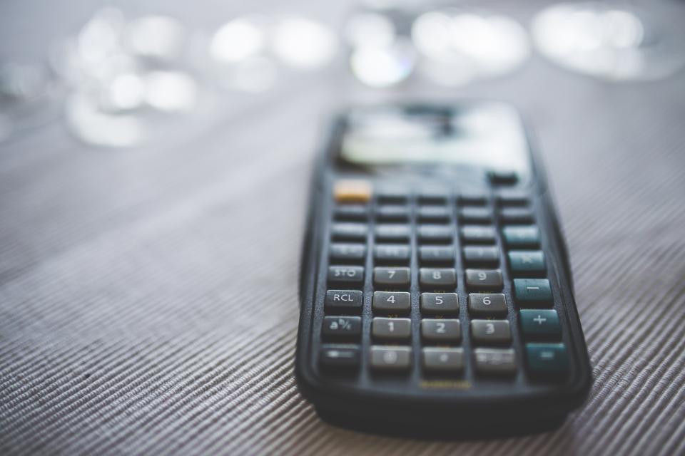 Close-up of a calculator. How much does your opiate addiction cost?