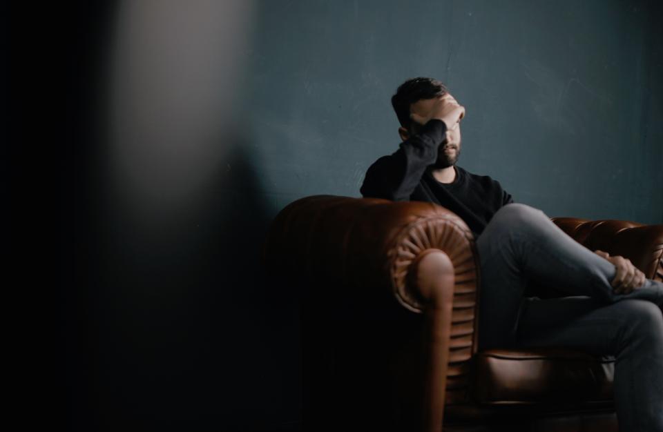 man-holding-his-head