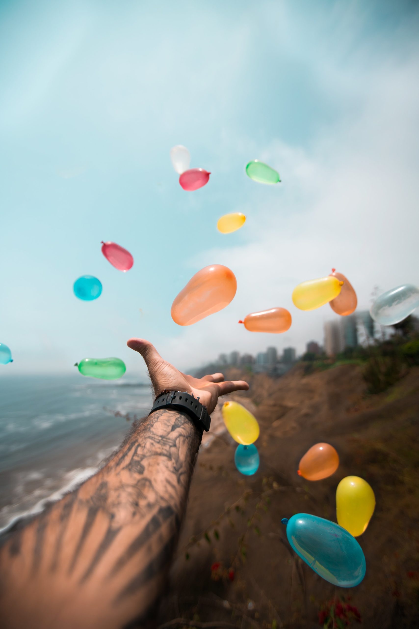 man-throwing-balloons