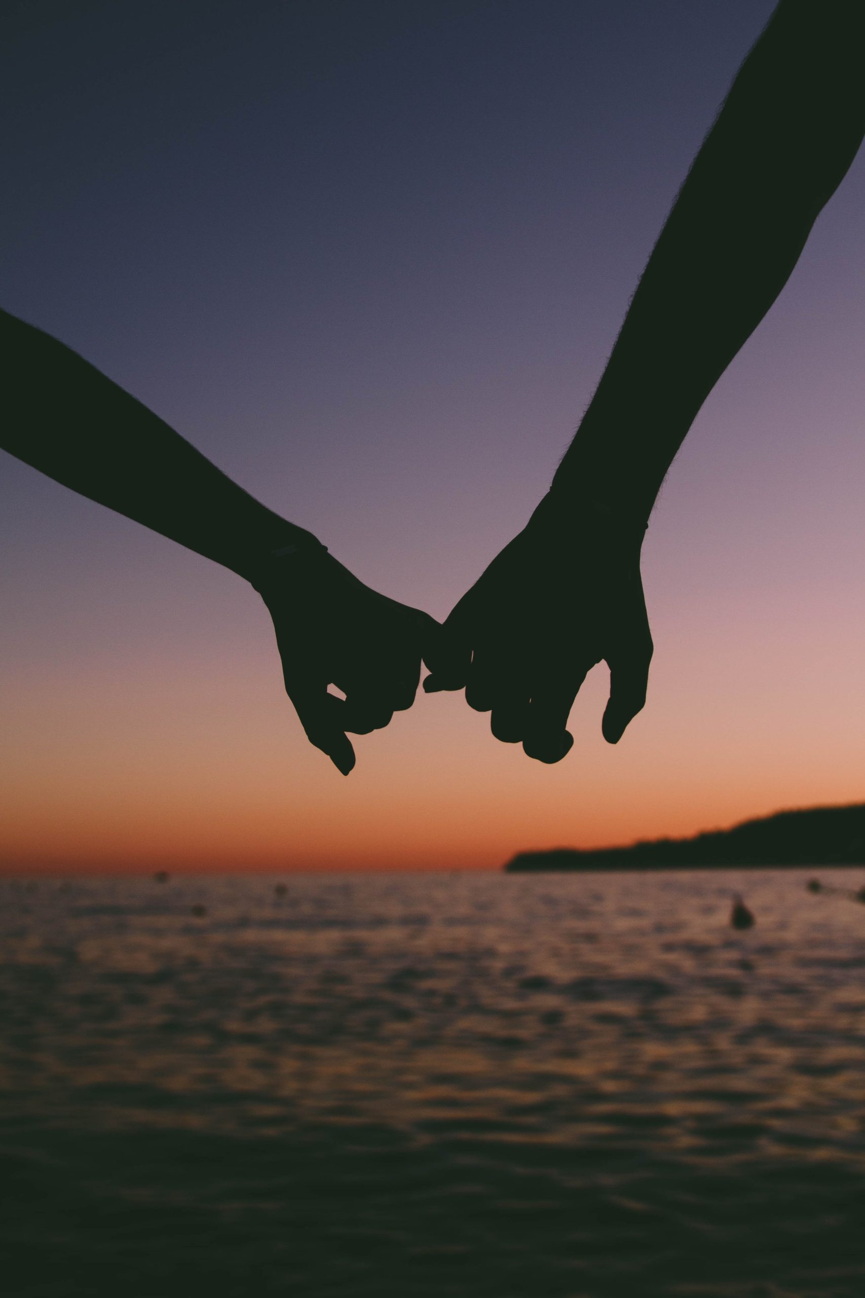 people-holding-hands-on-the-beach