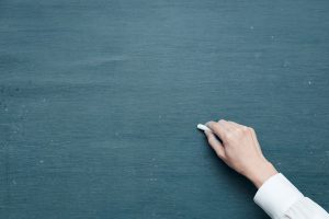 hand-chalk-board
