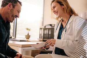 woman-doctor-smiling-man-patient