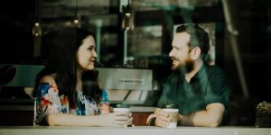 man-woman-talking-coffee-shop