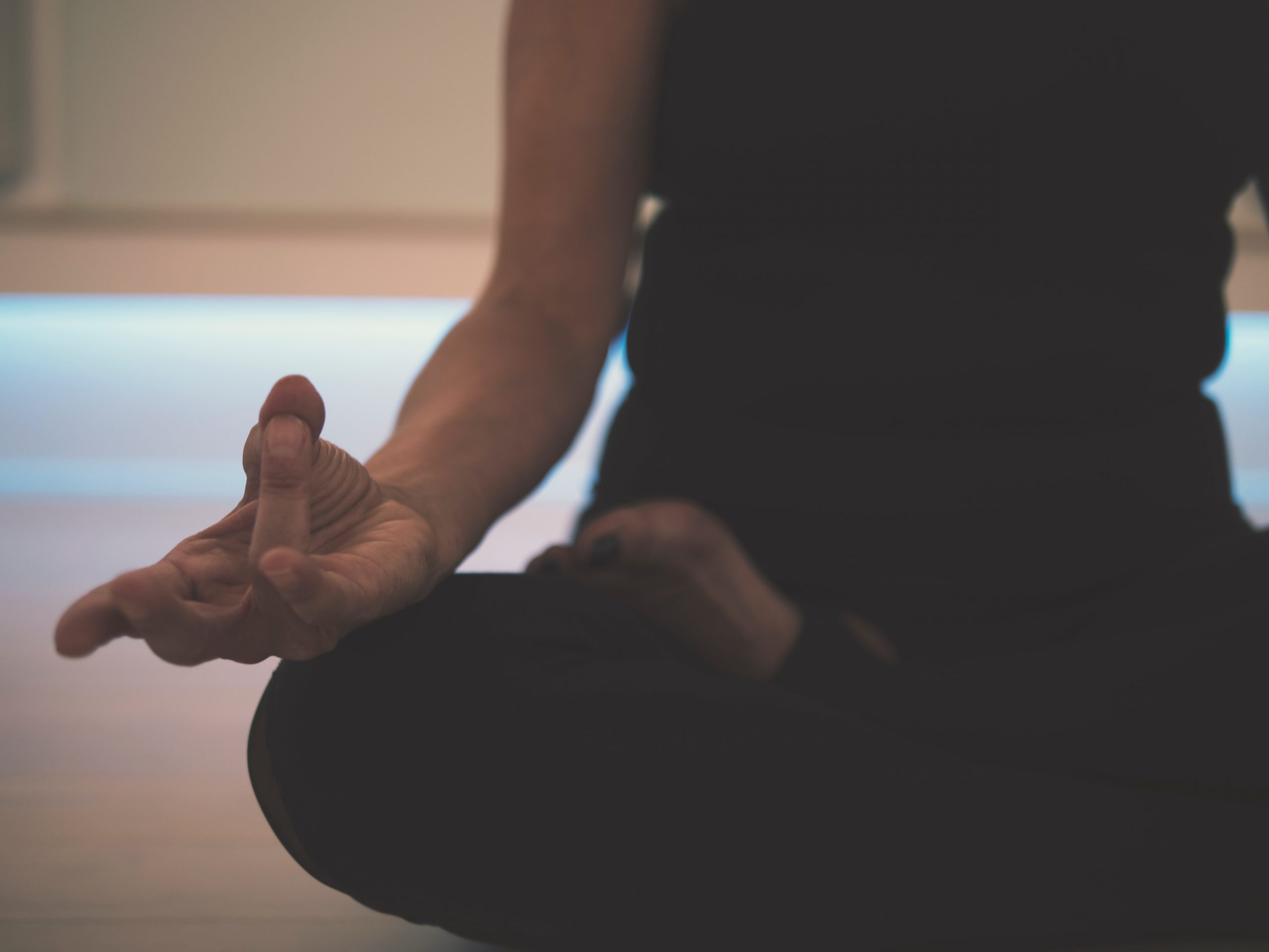 A person sitting in lotus position