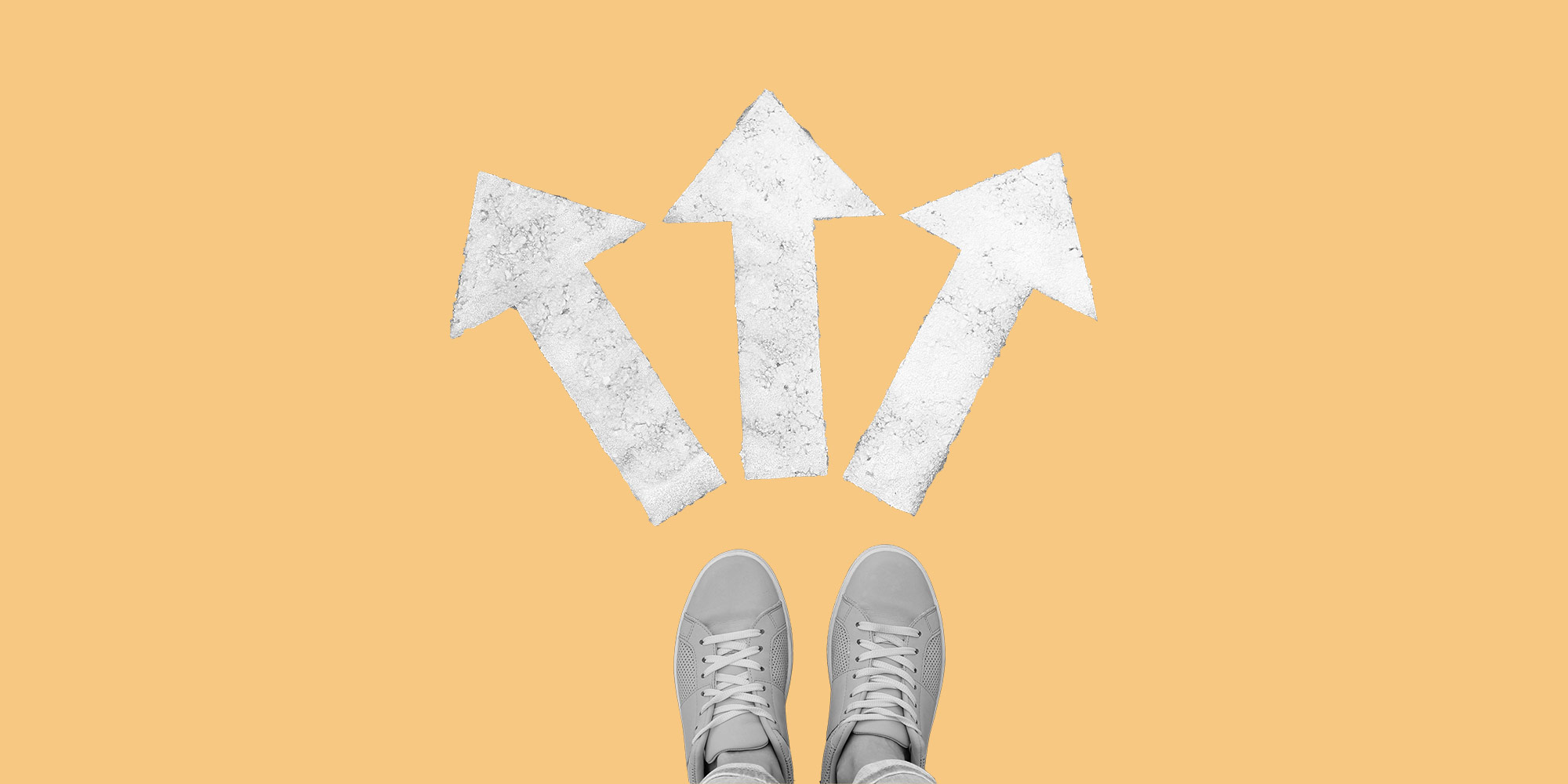 Looking down at a pair of feet and diverging arrows on the ground. Non-clinical pathways to recovery