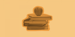 a stack of books with an apple on top