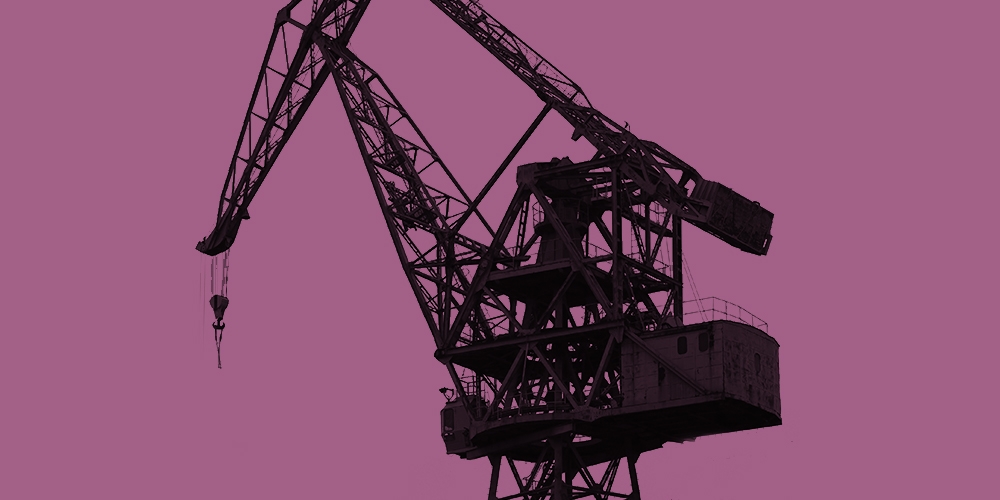 Grayscale photo of a construction crane against a magenta background