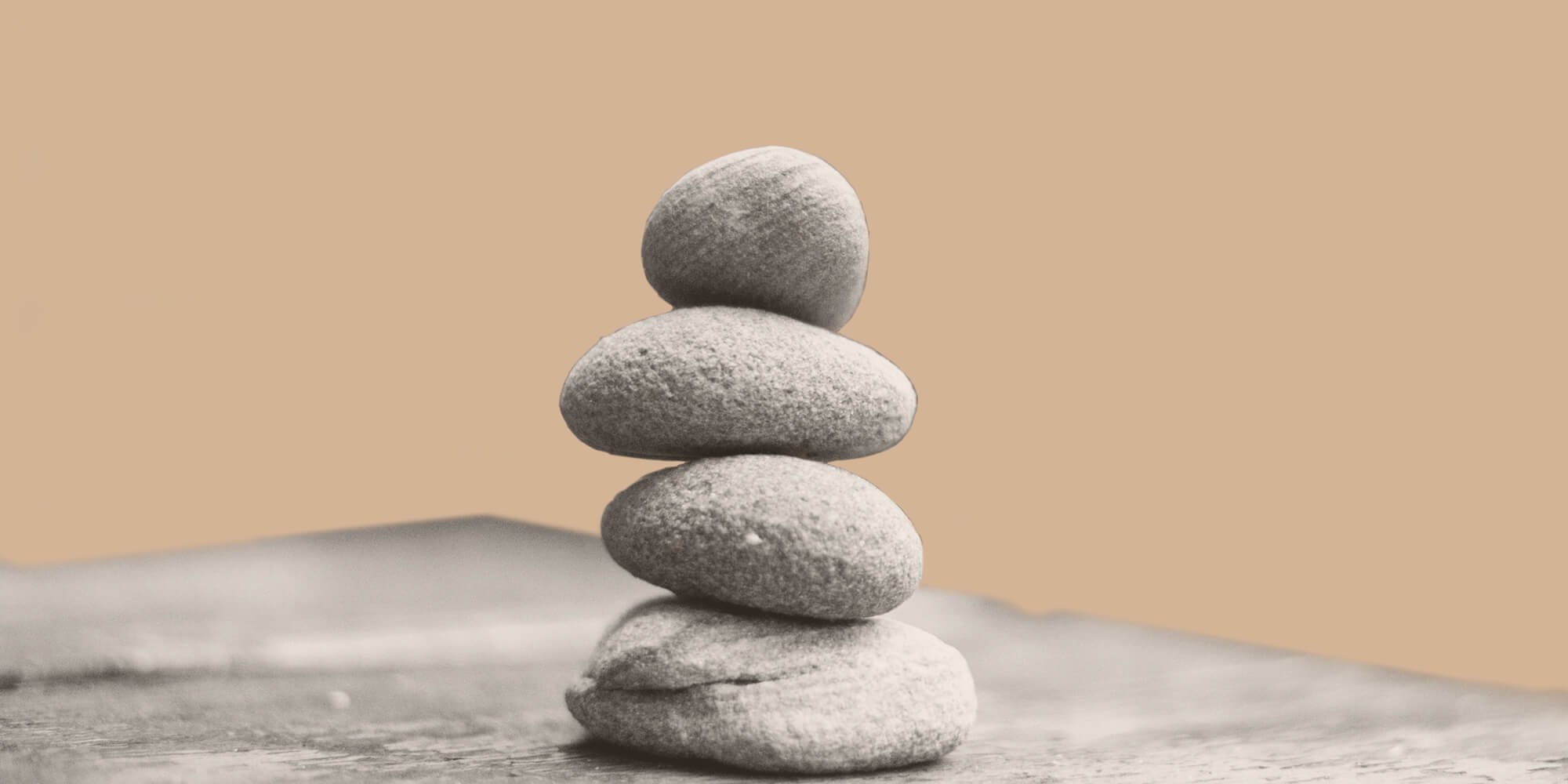 Four stones balanced atop one another. Slef-care