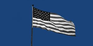 American flag on a blue background. President Biden's opioid plan
