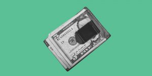 Money clip on green background. What does it mean to be financially sober?