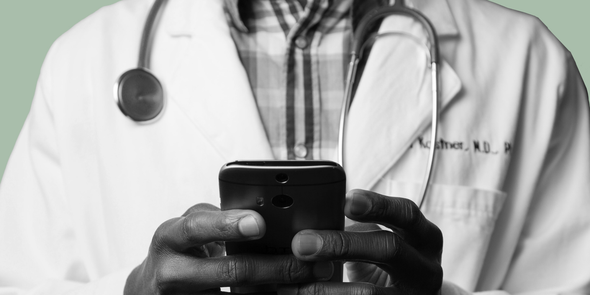 Telemedicine key terms. Doctor using a smartphone.