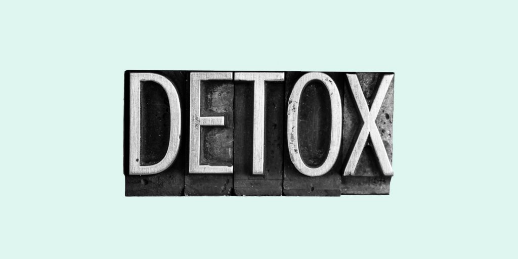 Typesetters blocks spelling out the word "Detox." Detox from alcohol
