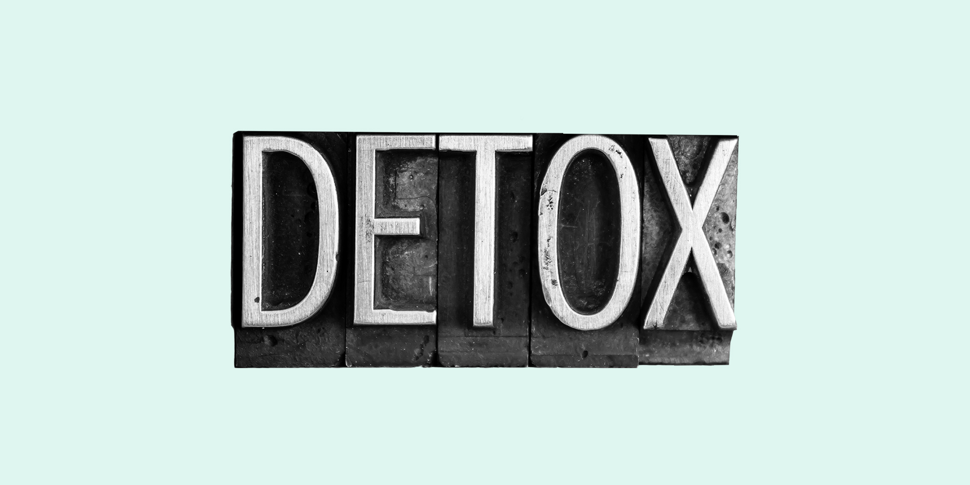 Typesetters blocks spelling out the word "Detox." Detox from alcohol