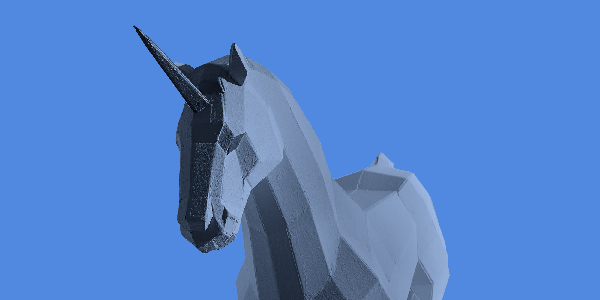 Unicorn made up of geometric planes on a bright blue backdrop. Queering recovery