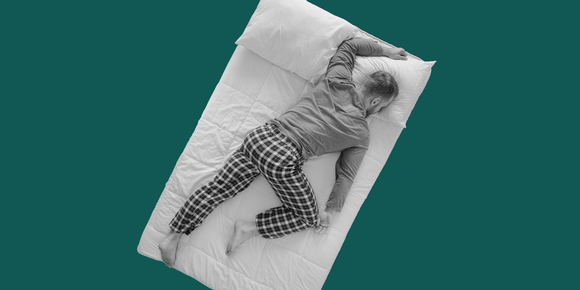 A man sleeping spread face-down across his bed. Treat insomnia without drugs