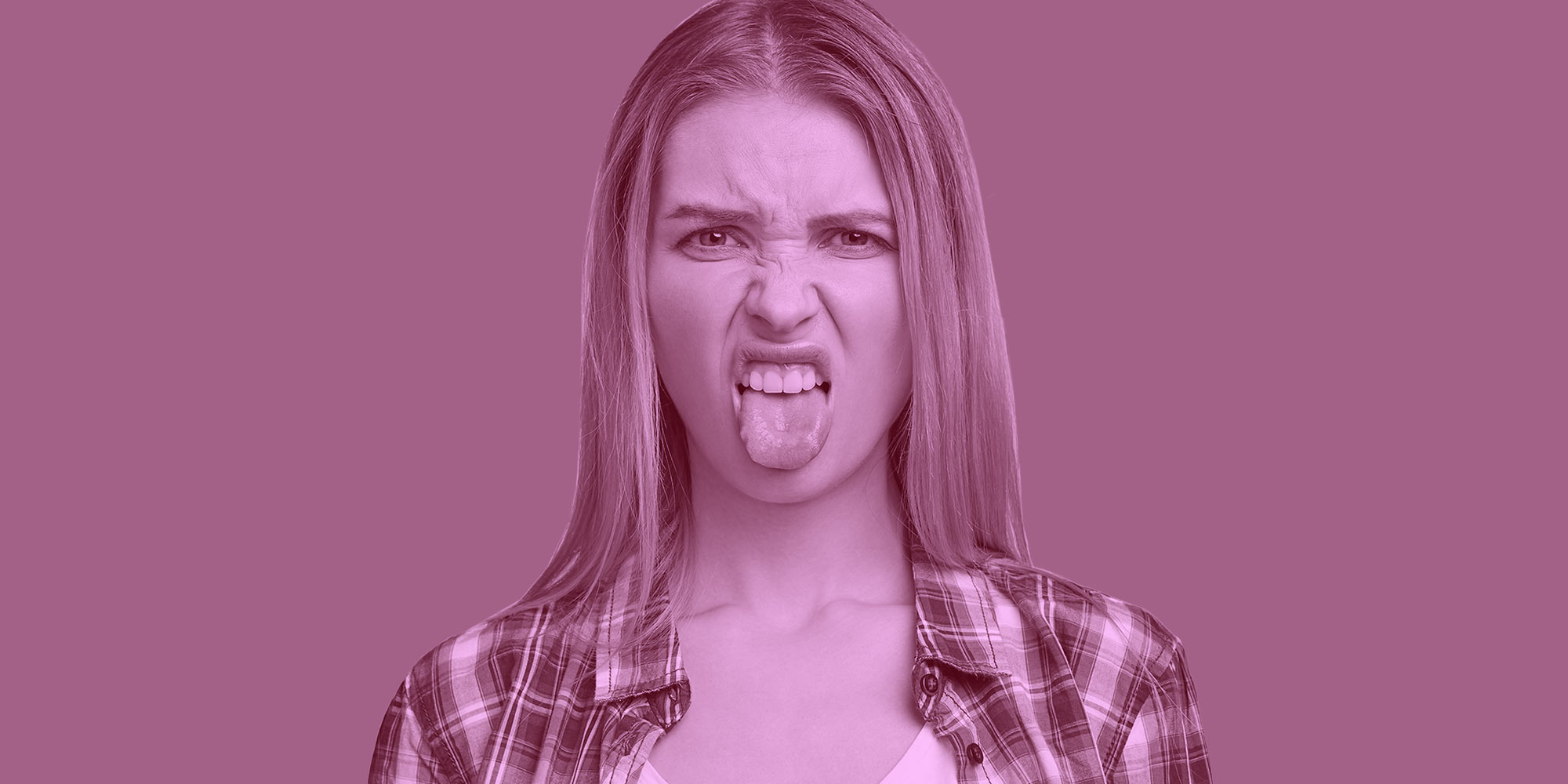 Woman making a disgusted face with her tongue sticking out. Suboxone tastes bad.