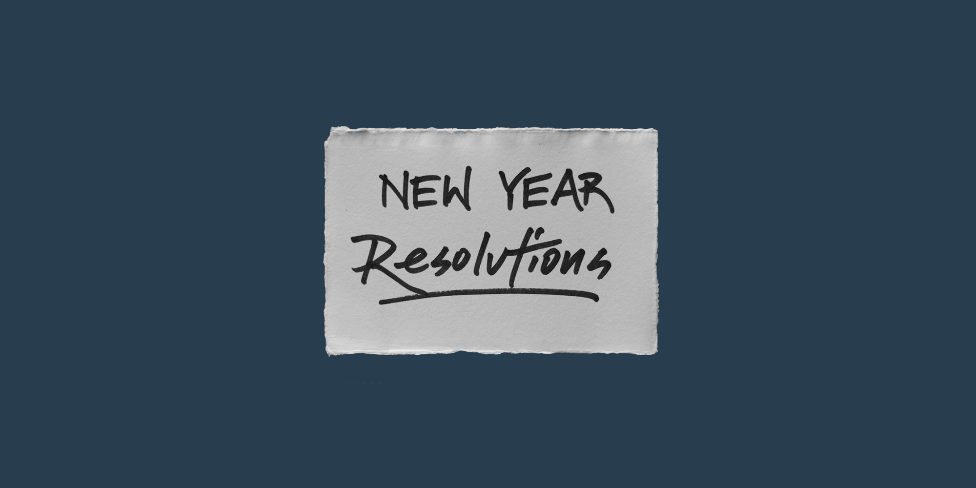 Handwritten note that says "New Year Resolutions". New Year's resolutions fail often.