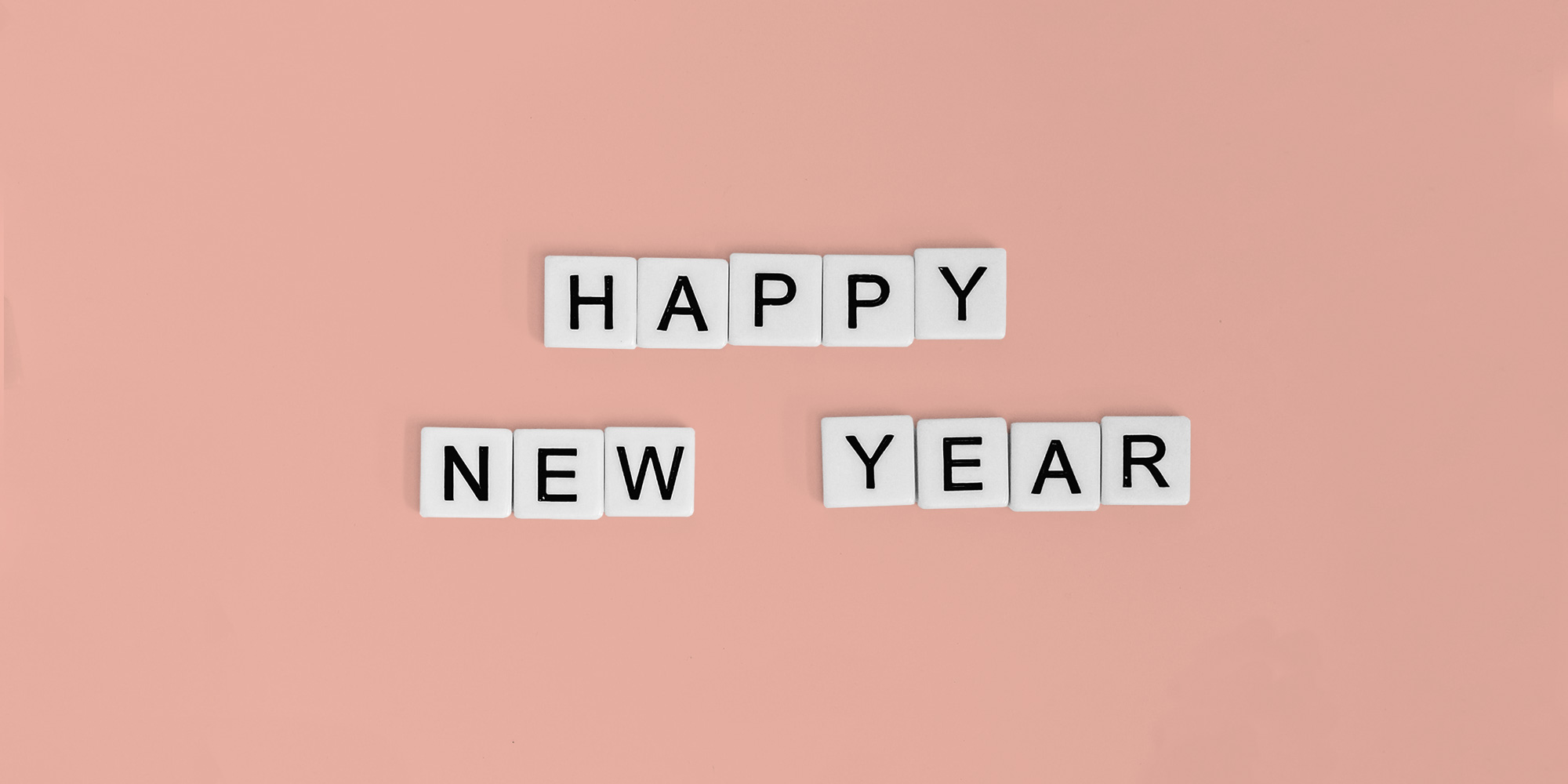 Letter tiles spelling out Happy New Year. Celebrate New Year's Eve without drugs.