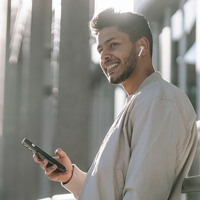 Hispanic man using phone for recovery