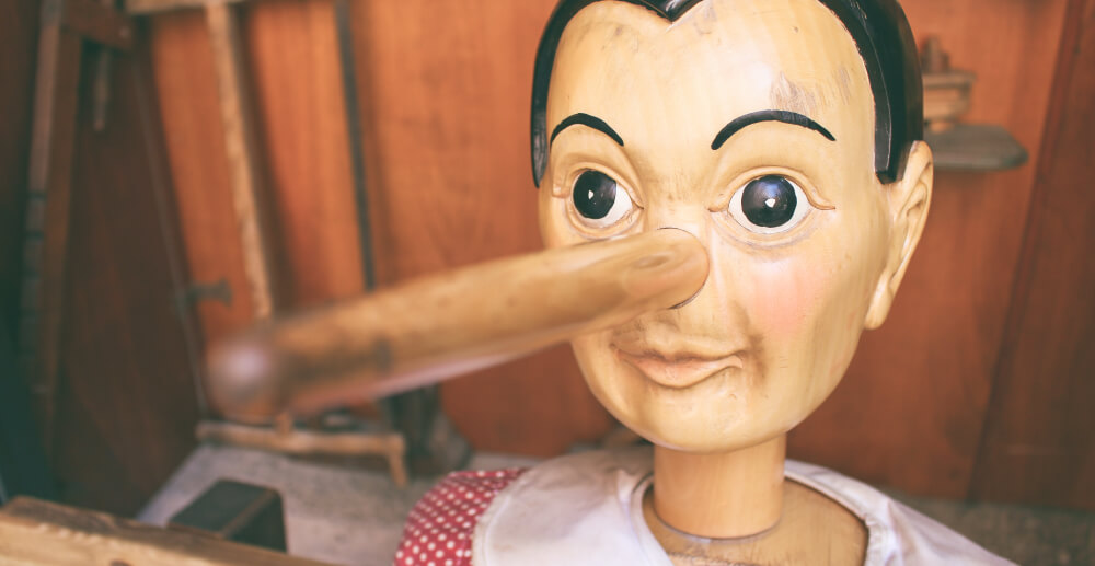 Pinocchio puppet with a long nose. Lies addicts tell ourselves.