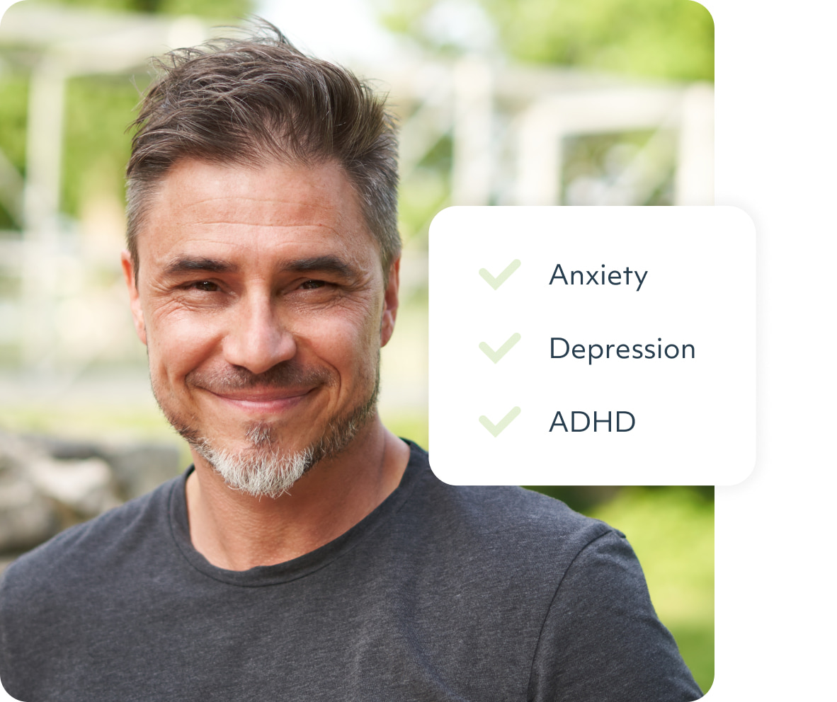 A man outdoors with wind swept hair with a list to the right of his face - anxiety, depression, adhd
