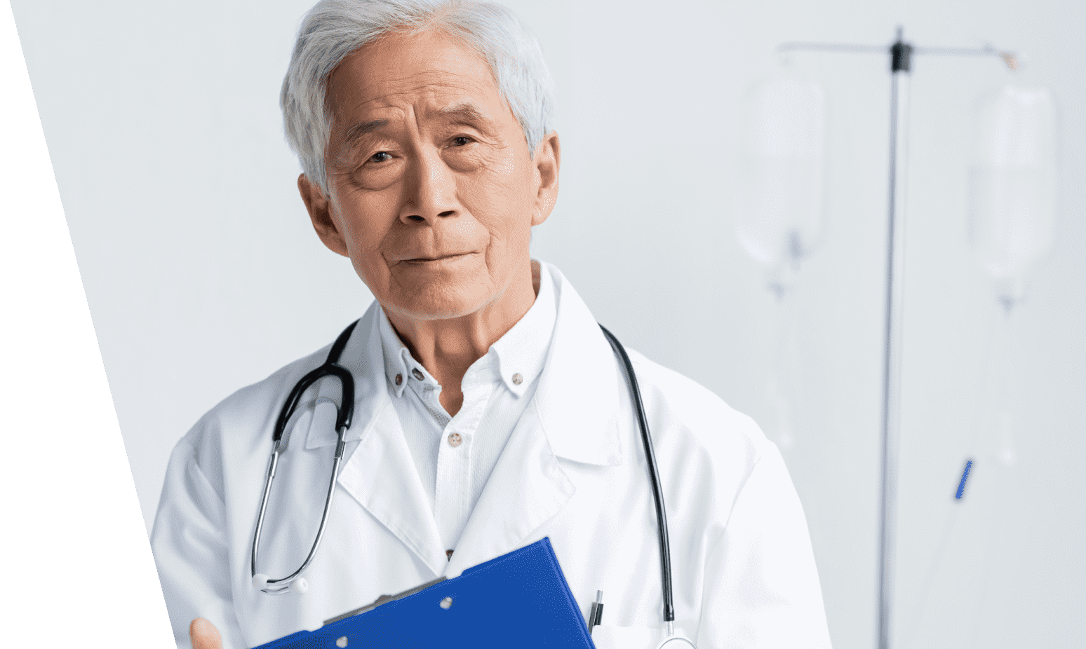 An older doctor holding a blue clip board