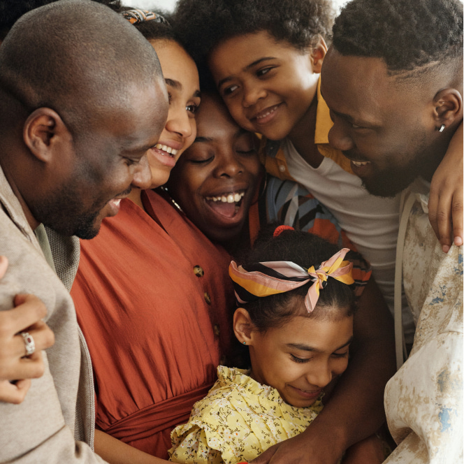 Five members of a family hugging