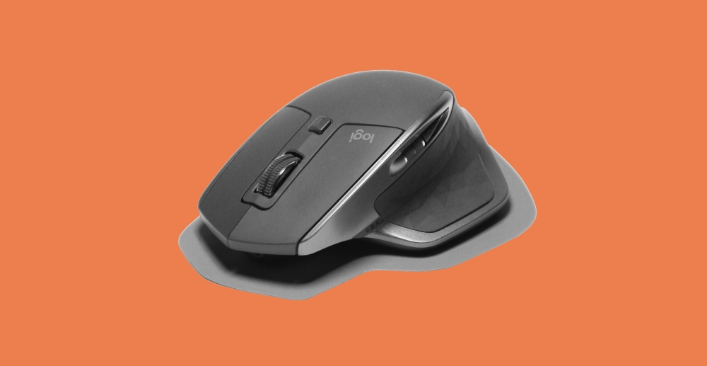 Gaming mouse on an orange background. How I realized I was spending too much time playing games