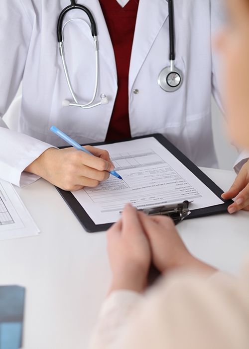 Doctor's hands during a patient consult. Medical professionals suffer from addiction