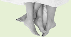 Two people's feet tangled together in bed. Sexual side effects of Suboxone