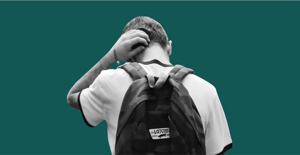 Teen boy wearing a backpack, seen from behind. Treatment Options For Teens with Addiction