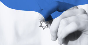 A hand holding a Star of David pendant. A bue wave shape overlays the top of the image.Yom Kippur and principles of recovery.
