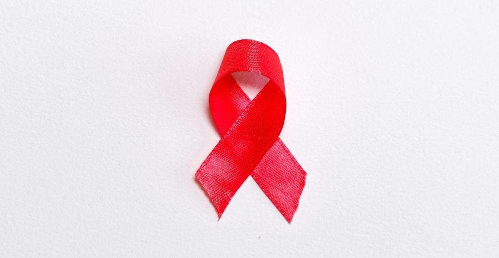 Red awareness ribbon. Fighting stigma on World AIDS Day