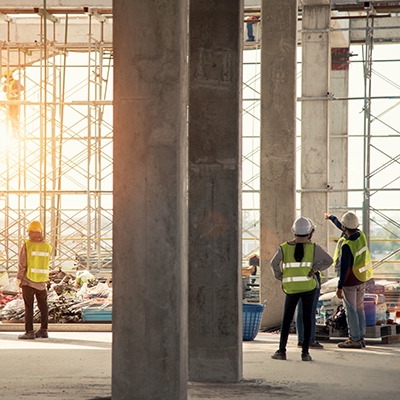 Workers in protective gear at a construction site