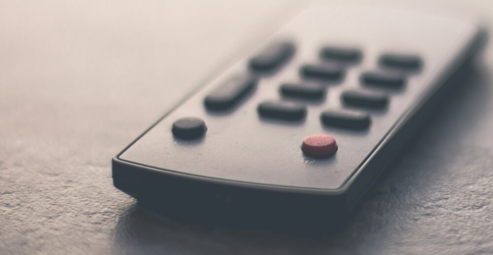 A remote control sitting on a table