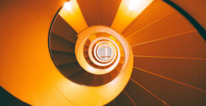 A spiral of orange stairs