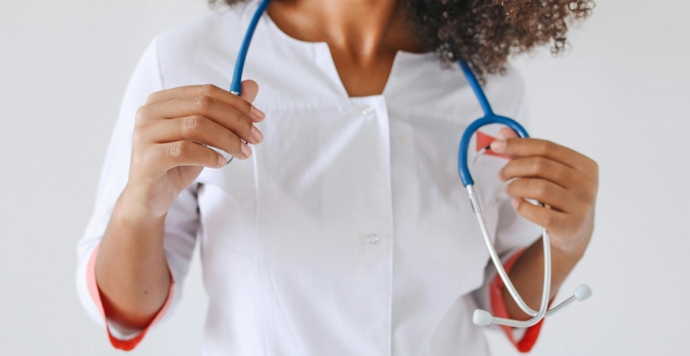 Female doctor with a stethoscope around her neck.