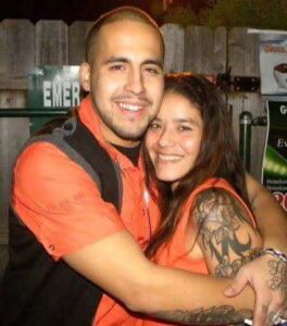 Shawn and his sister, both wearing orange