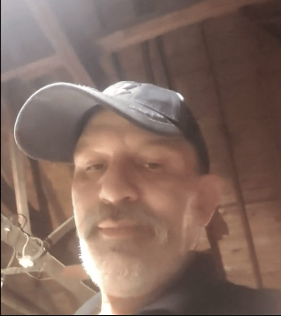 Randy in his home, on a video call