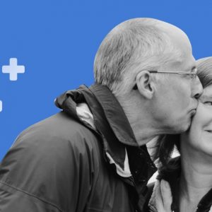 Older man kisses an older woman on the cheek. Blue background with the Medicare cross symbol. What addiction treatment does medicare cover?