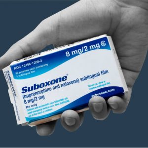 hand holding a Suboxone box. Can you prescribe Suboxone via telemedeicine?