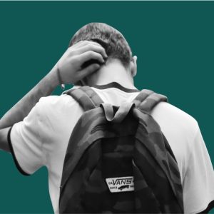 Teen boy wearing a backpack, seen from behind. Treatment Options For Teens with Addiction