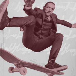 Brandon Novak performing a skateboard trick in a three-piece suit. Brandon's Novak: Rising from Rock Bottom