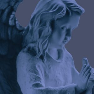 Statue of a sweet, childish angel holding a dove. Grieving