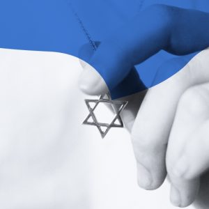 A hand holding a Star of David pendant. A bue wave shape overlays the top of the image.Yom Kippur and principles of recovery.