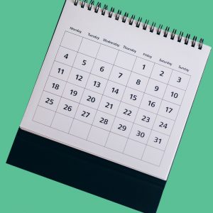 Monthly calendar on a green background. 30 day sobriety guide