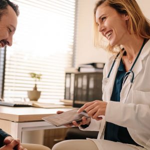 woman-doctor-smiling-man-patient